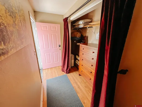 wooden floor with a bathroom