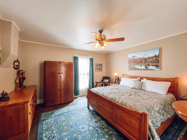 a bedroom with a bed and dresser