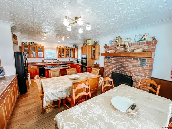 a dining room with furniture and a fireplace