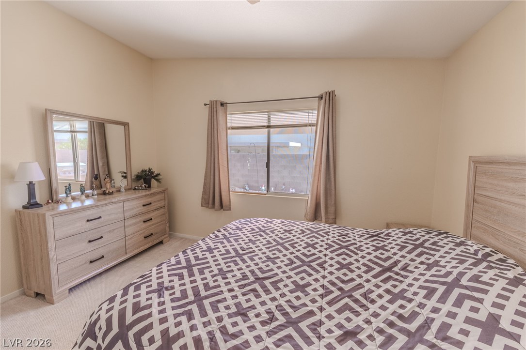 4994 Mascaro Drive Las Vegas, NV 89122 - Photo 10 of 30 Comfortable carpeting and a bright window create a relaxing private space.