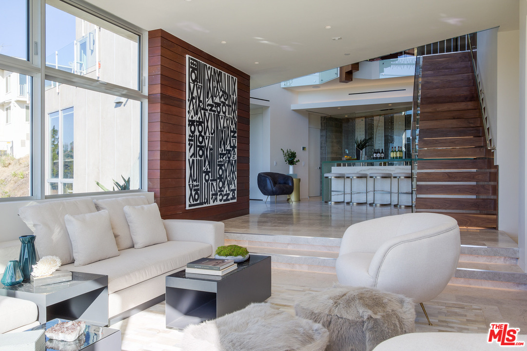 1979 Stradella Road Los Angeles, CA 90077 - Photo 12 of 38 a living room with furniture and a large window