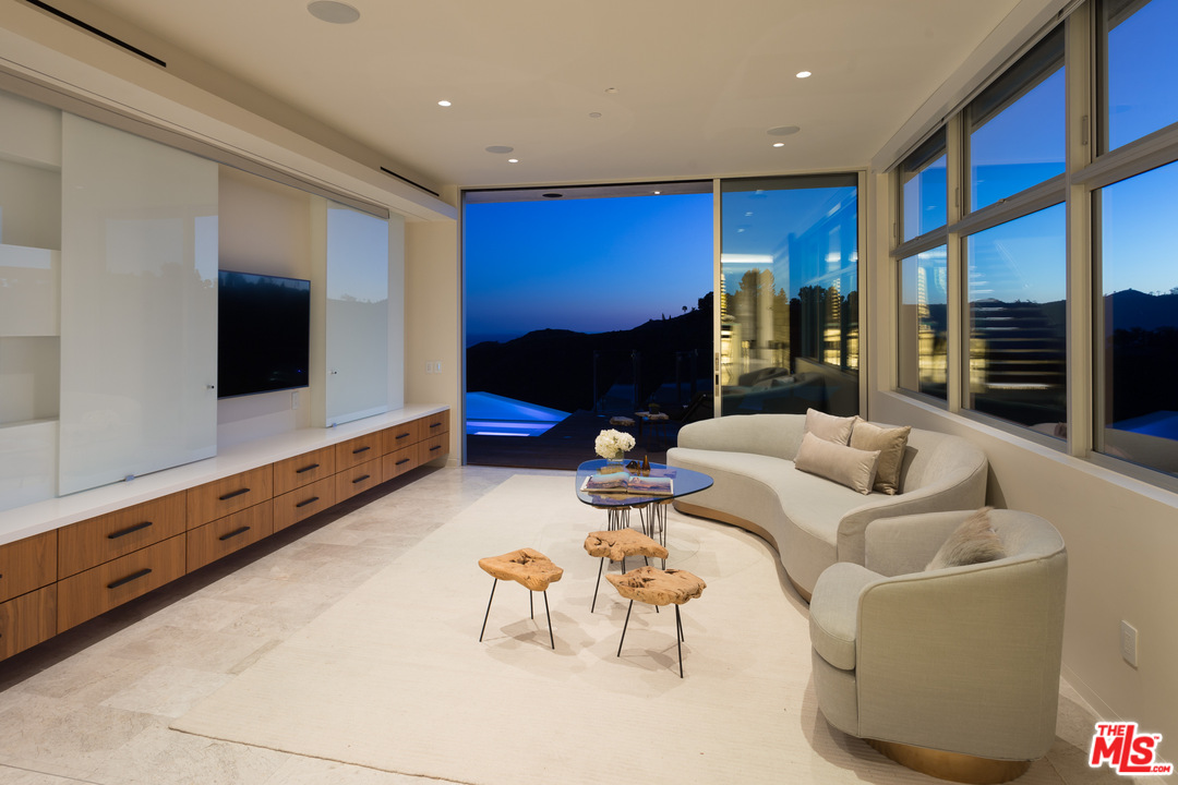 1979 Stradella Road Los Angeles, CA 90077 - Photo 13 of 38 a living room with furniture and a flat screen tv