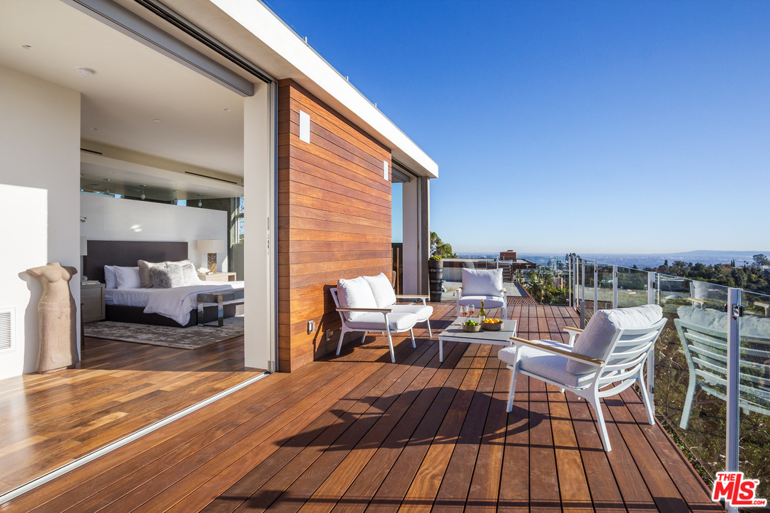 1979 Stradella Road Los Angeles, CA 90077 - Photo 17 of 38 a view of a terrace with seating area