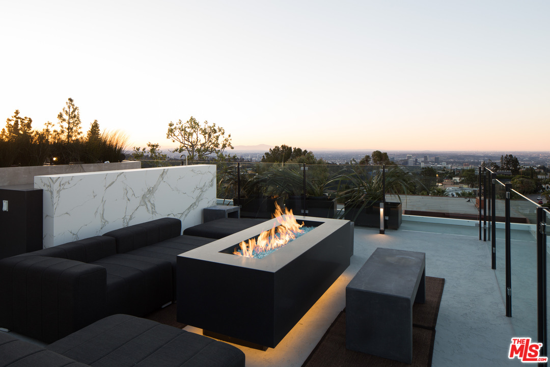 1979 Stradella Road Los Angeles, CA 90077 - Photo 30 of 38 a view of a terrace with couches and sky view