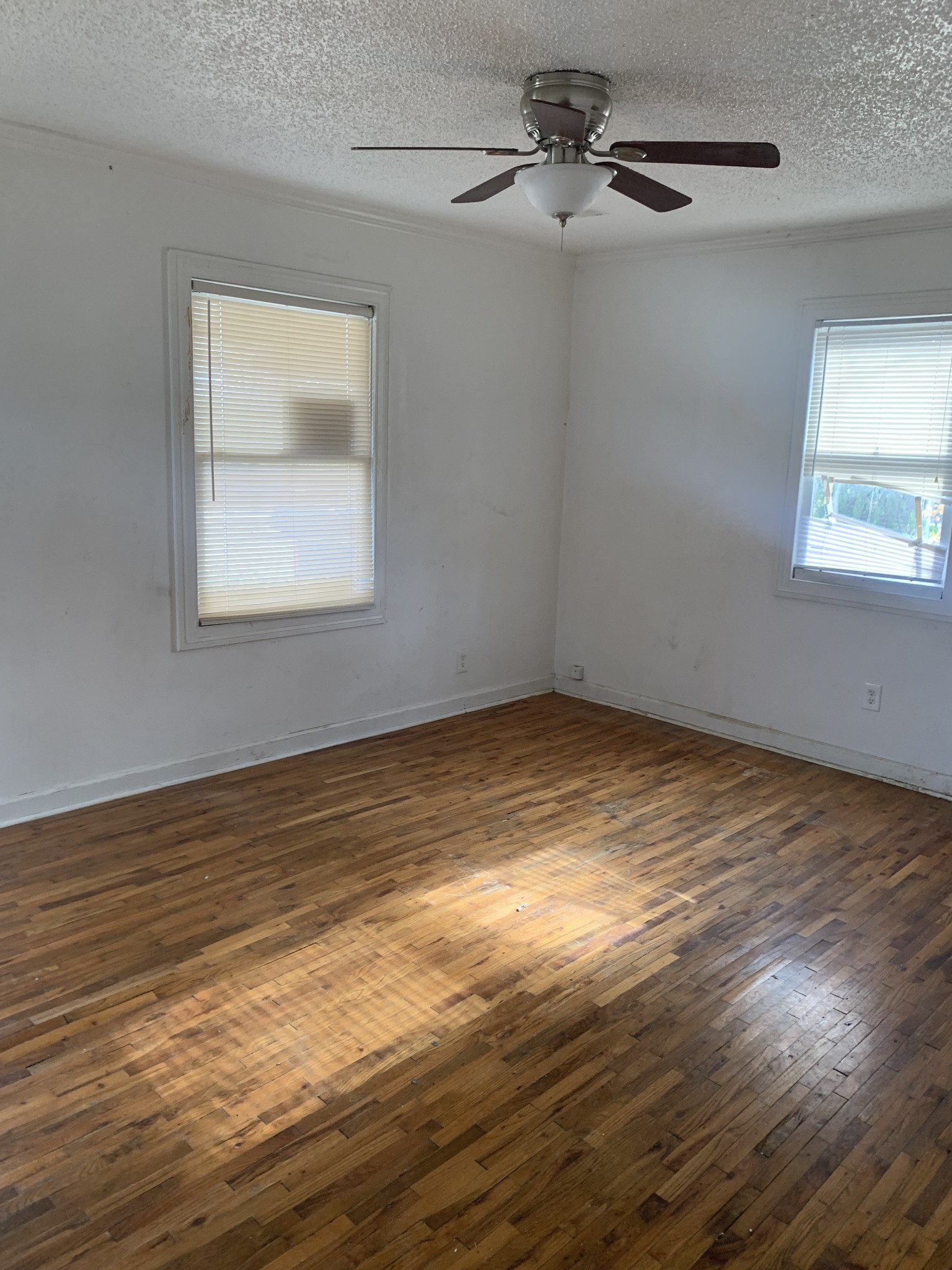 214 Myatt Drive Madison, TN 37115 - Photo 3 of 8 a view of an empty room with wooden floor and a window