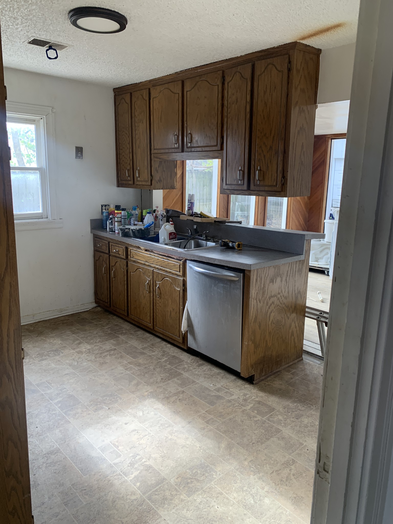 214 Myatt Drive Madison, TN 37115 - Photo 4 of 8 a kitchen with stainless steel appliances granite countertop a stove a sink and a microwave