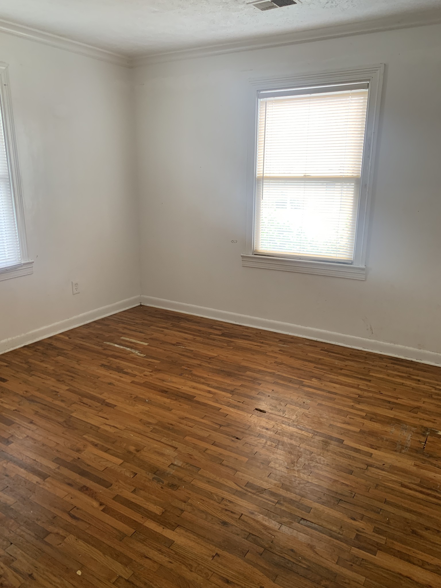 214 Myatt Drive Madison, TN 37115 - Photo 6 of 8 a view of an empty room with wooden floor and a window