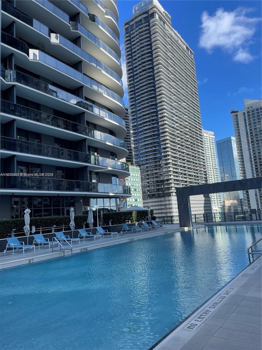 55 Southwest 9th Street, Unit 4304 Miami, FL 33130 - Photo 25 of 32 a view of pool with outdoor seating