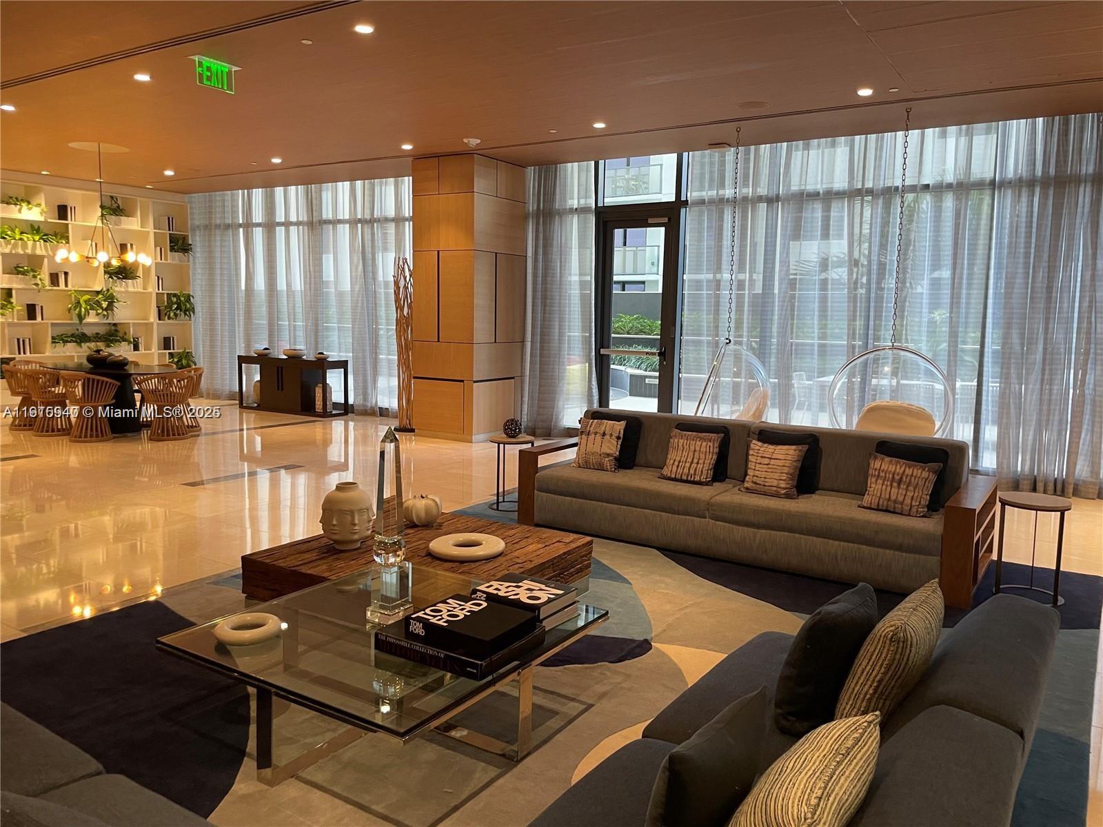 55 Southwest 9th Street, Unit 4304 Miami, FL 33130 - Photo 31 of 32 a living room with furniture and large windows