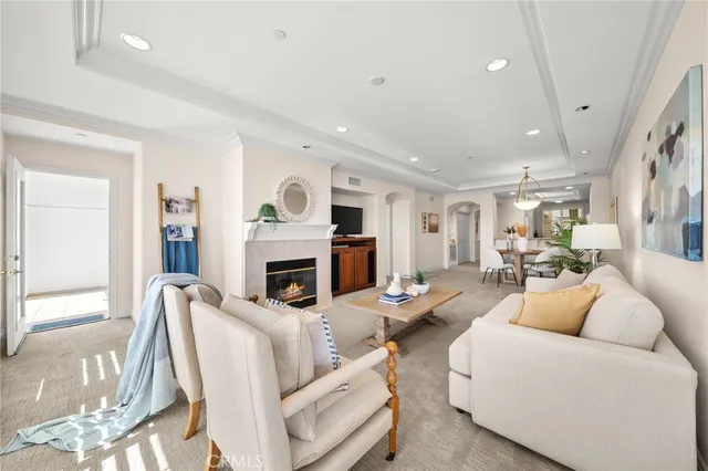 a living room with furniture fireplace and a television
