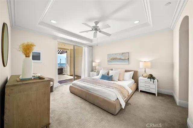 a bedroom with bed couch and window