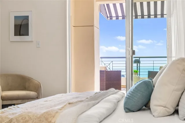 a bedroom with furniture and a window