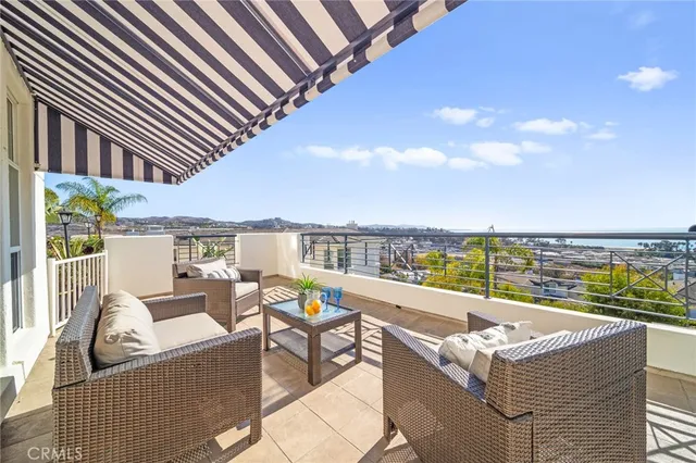 a balcony with furniture and city view