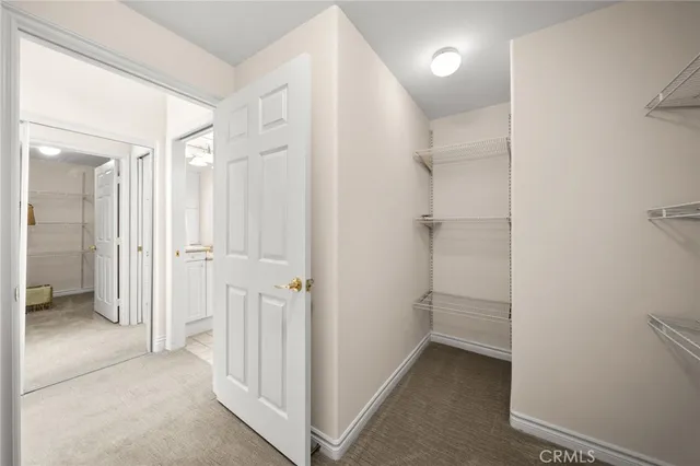 a spacious bathroom with a double vanity sink mirror and next to a window