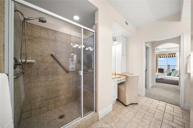 a large bathroom with a sink mirror and vanity
