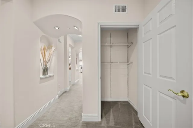 a view of a storage & utility room with dryer and washer