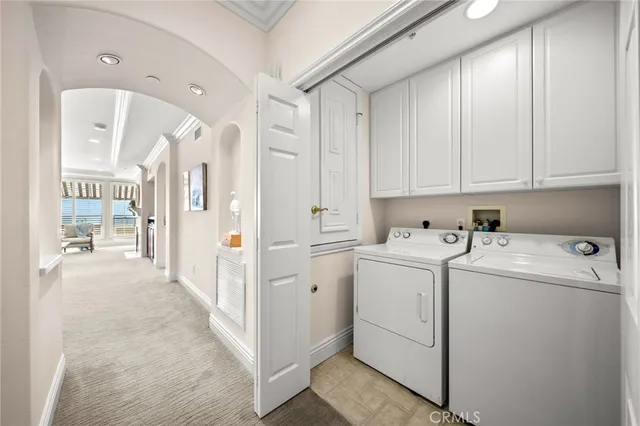 a view of a livingroom with wooden floor and a bathroom