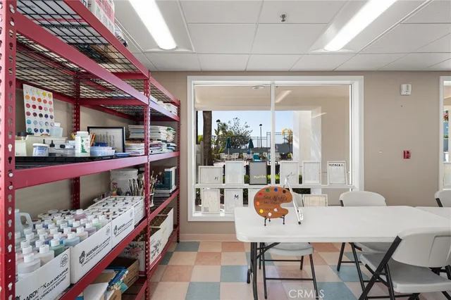 a view of swimming pool with outdoor seating and a palm tree