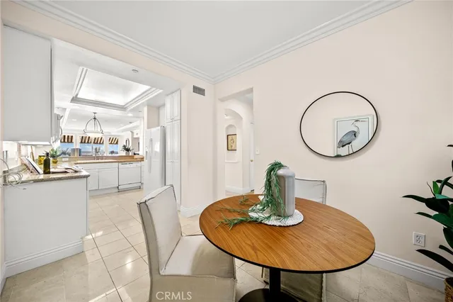 a kitchen with a table and chairs in it