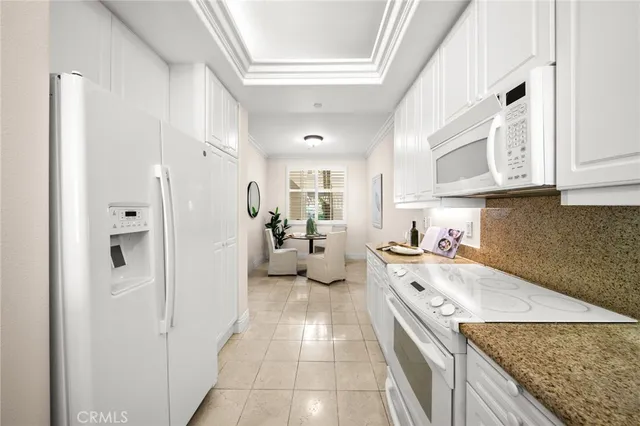 a kitchen with a sink stove and refrigerator