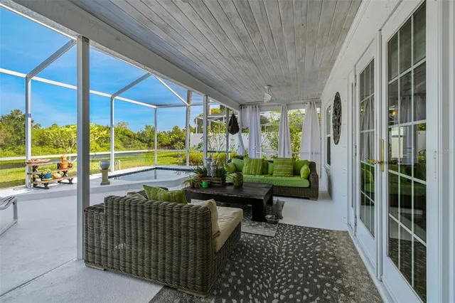 a view of a backyard with plants and a patio
