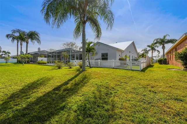 a view of a swimming pool with a patio and a garden
