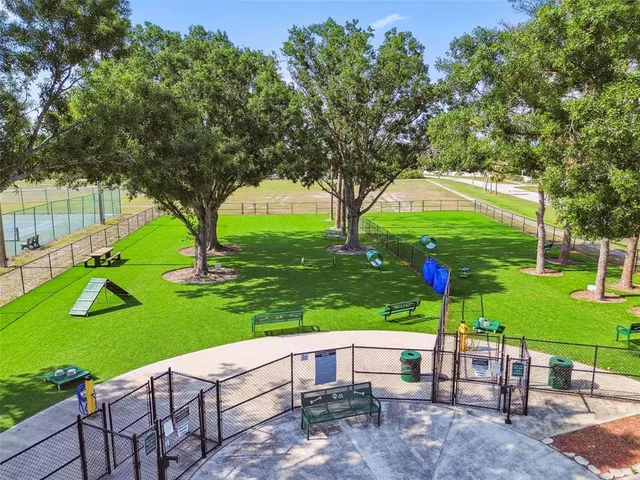 a view of a patio with chairs and an umbrella