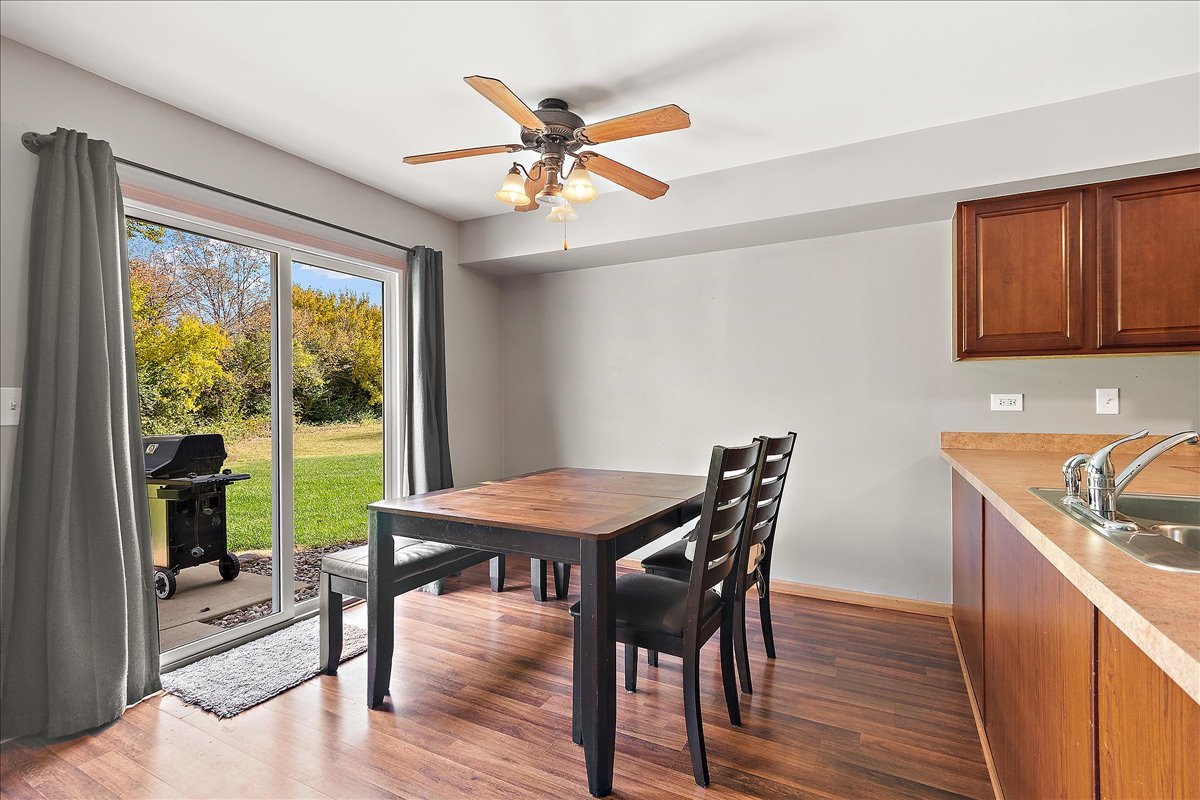 25273 Faraday Road Manhattan, IL 60442 - Photo 7 of 20 a view of a dining room with furniture window and wooden floor