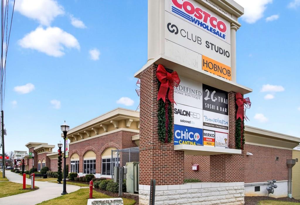 3668 Kingsboro Road Northeast, Unit 10 Atlanta, GA 30319 - Photo 24 of 43 a street sign on a pole on a street