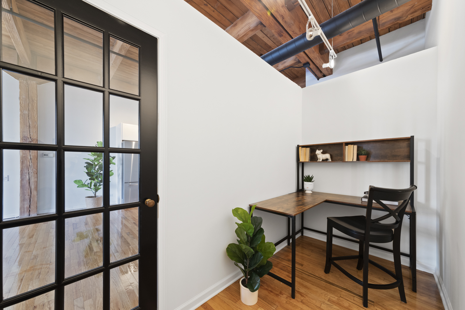 1017 West Washington Boulevard, Unit 5B Chicago, IL 60607 - Photo 11 of 13 a view of a workspace room with furniture and a window