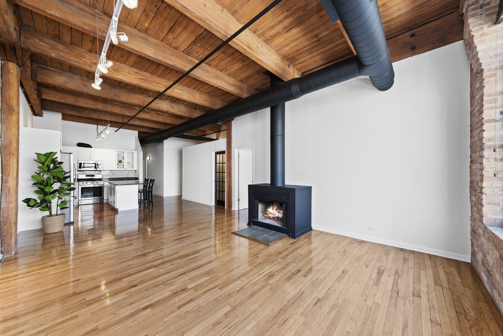 1017 West Washington Boulevard, Unit 5B Chicago, IL 60607 - Photo 3 of 13 a view of empty room with wooden floor
