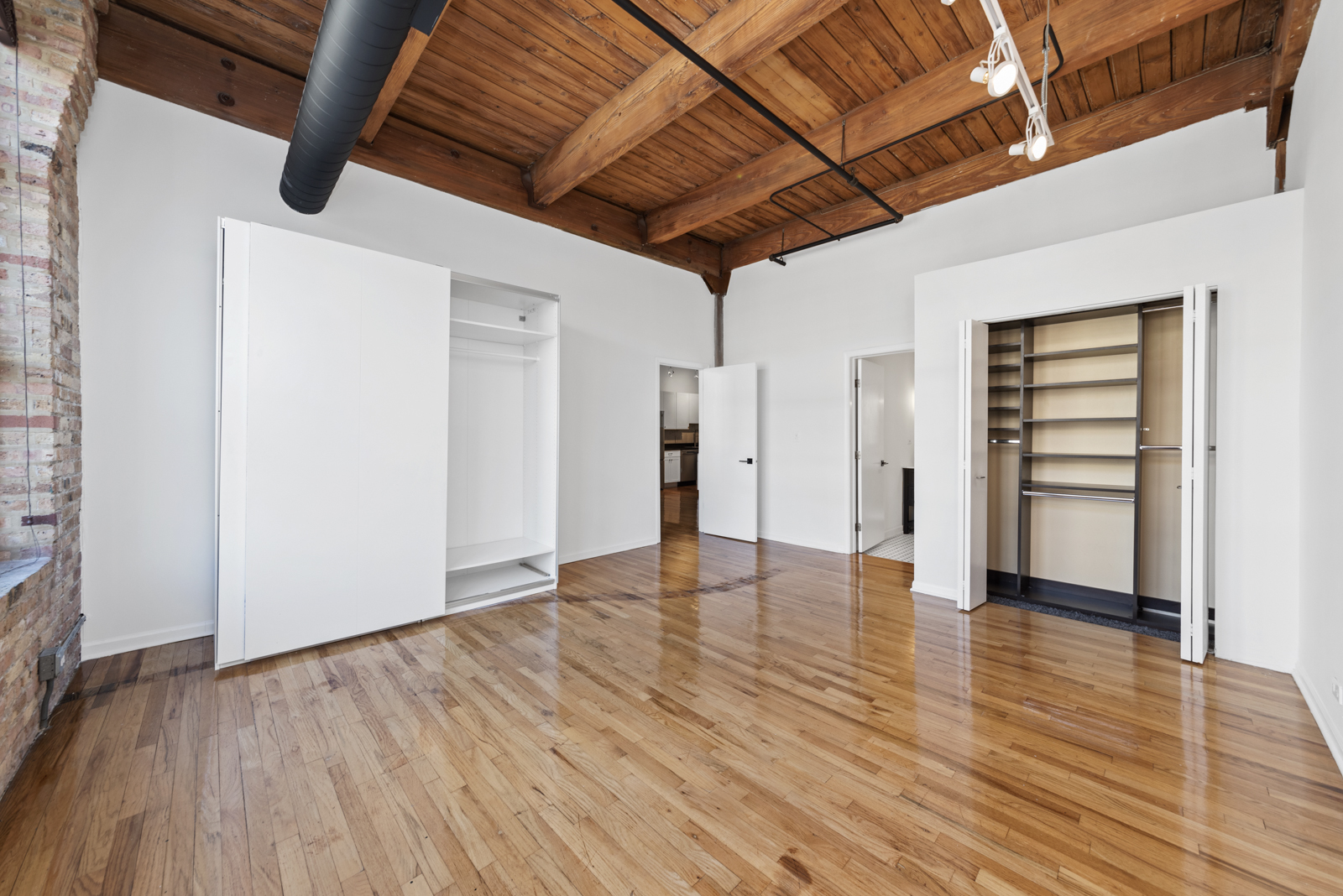 1017 West Washington Boulevard, Unit 5B Chicago, IL 60607 - Photo 8 of 13 a view of empty room with wooden floor