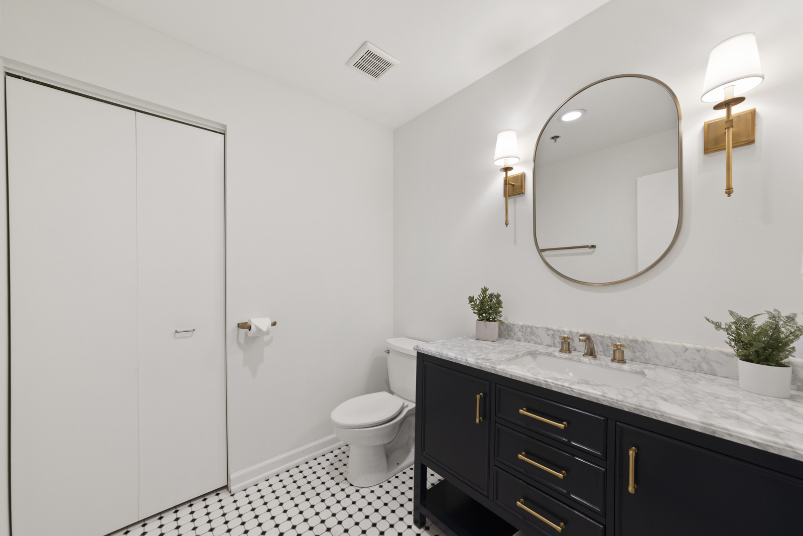 1017 West Washington Boulevard, Unit 5B Chicago, IL 60607 - Photo 10 of 13 a bathroom with a sink a toilet and a mirror