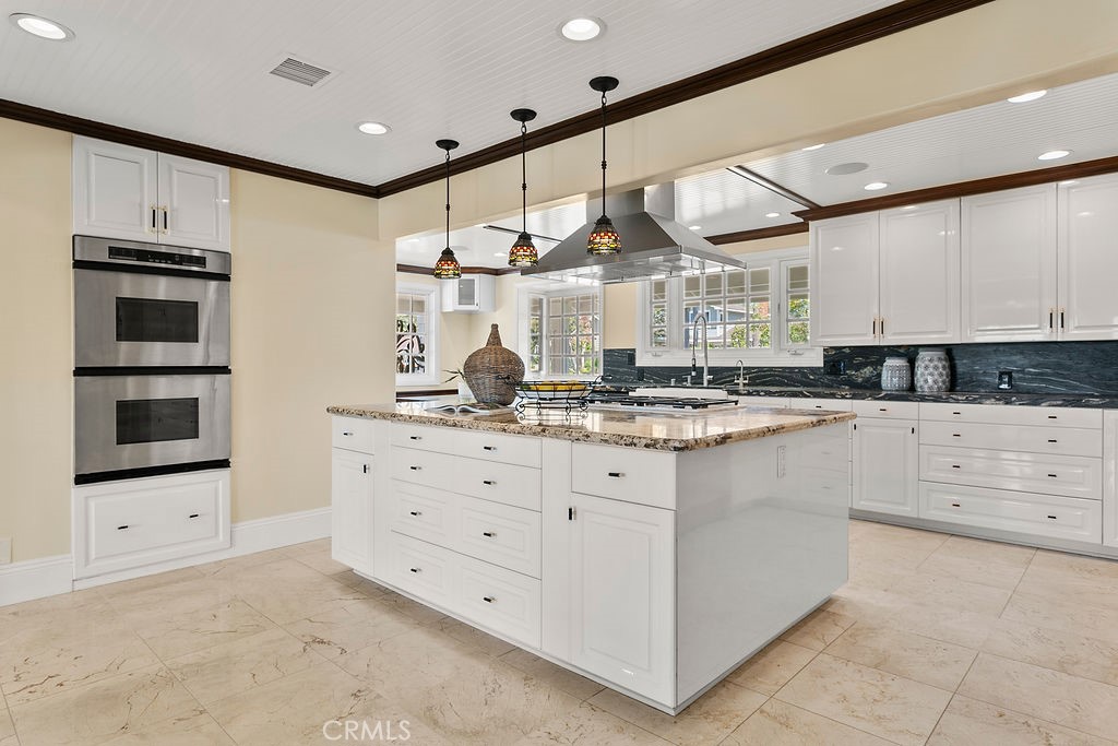 9631 Fleet Road Villa Park, CA 92861 - Photo 20 of 64 a kitchen with granite countertop a stove and a sink