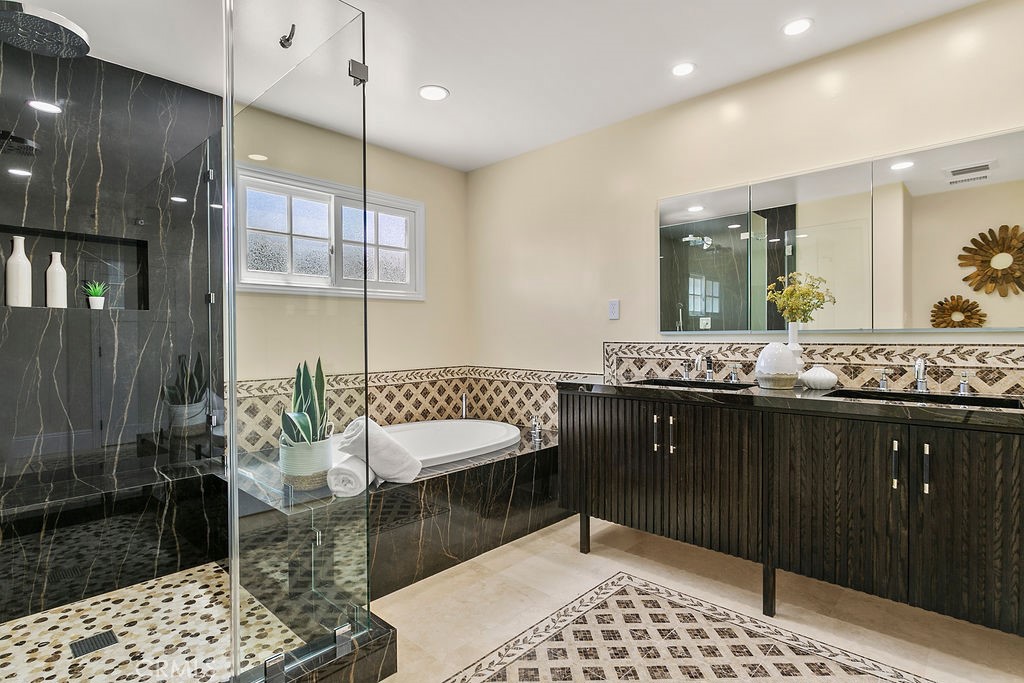 9631 Fleet Road Villa Park, CA 92861 - Photo 33 of 64 a bathroom with a sink and a mirror
