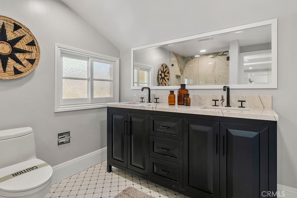 9631 Fleet Road Villa Park, CA 92861 - Photo 35 of 64 a bathroom with a sink and a mirror