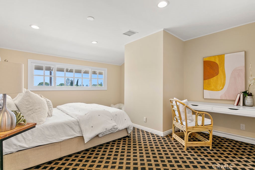 9631 Fleet Road Villa Park, CA 92861 - Photo 37 of 64 a bedroom with a bed and wooden floor