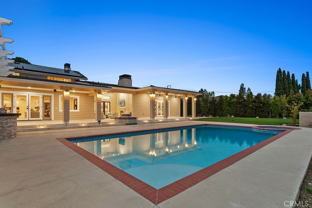 9631 Fleet Road Villa Park, CA 92861 - Photo 48 of 64 a view of a swimming pool with an outdoor seating