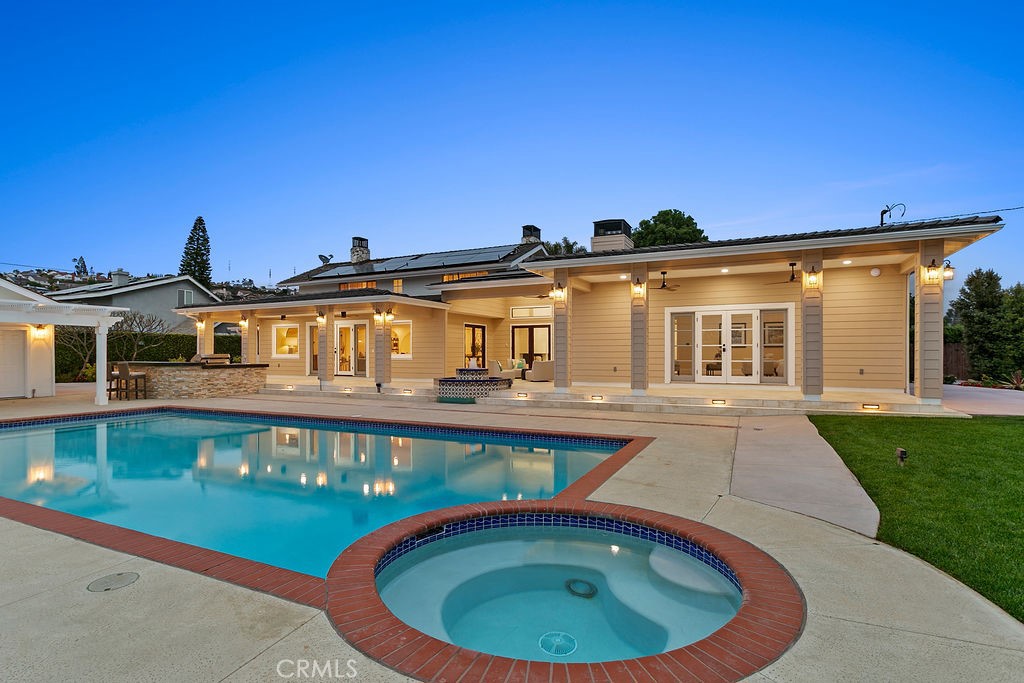 9631 Fleet Road Villa Park, CA 92861 - Photo 49 of 64 a front view of a house with swimming pool having outdoor seating