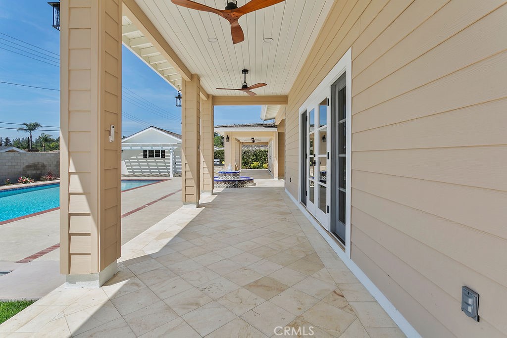 9631 Fleet Road Villa Park, CA 92861 - Photo 53 of 64 a view of a hallway with the glass door