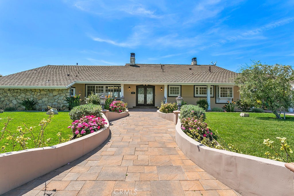 9631 Fleet Road Villa Park, CA 92861 - Photo 62 of 64 a front view of a house with a garden