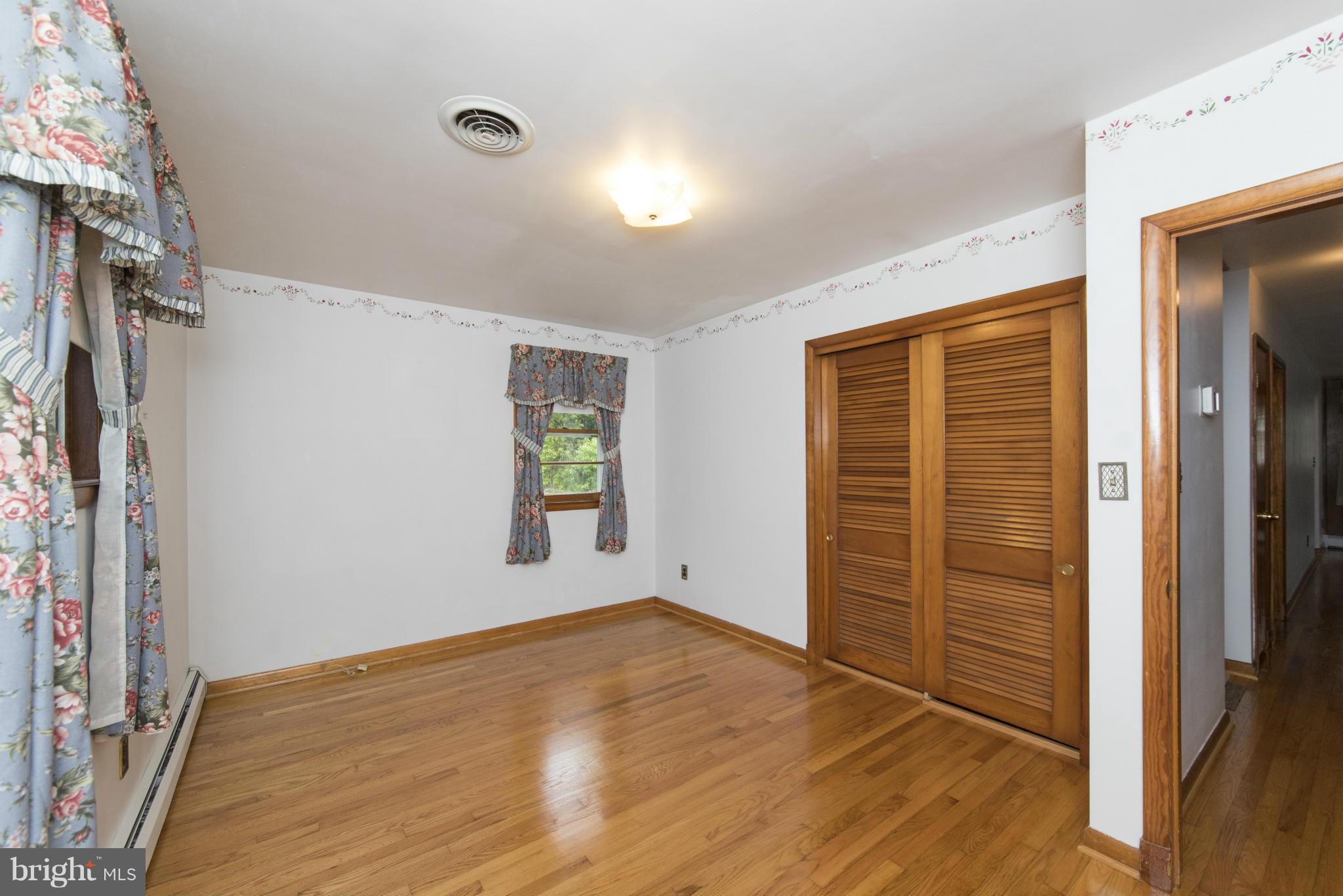 2508 Philadelphia Road Edgewood, MD 21040 - Photo 14 of 30 a view of empty room with wooden floor and fan