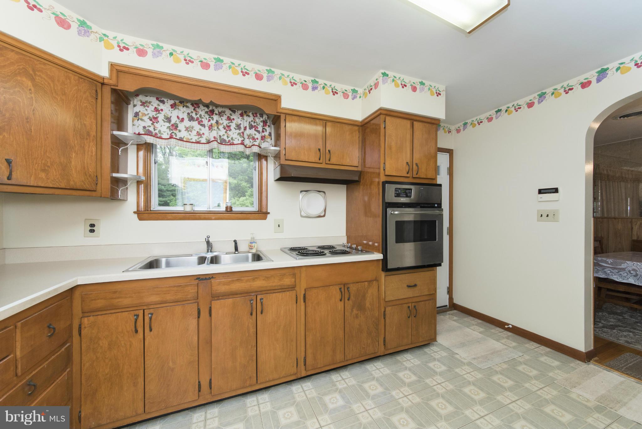 2508 Philadelphia Road Edgewood, MD 21040 - Photo 8 of 30 a kitchen with stainless steel appliances a sink and cabinets