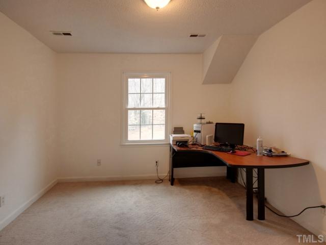 8704 Oneal Road Raleigh, NC 27613 - Photo 10 of 12 Spacious secondary bedrooms with walk in closets. Neutral paint color.