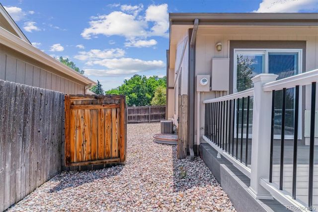 a aerial view of a house with swimming pool and a yard