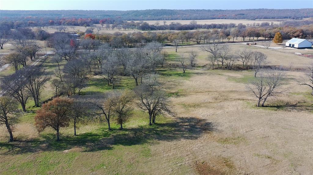 1551 Wilson Bend Road Millsap, TX 76066 - Photo 21 of 22 an aerial view of residential houses with outdoor space and trees