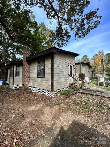 a house with trees in the background