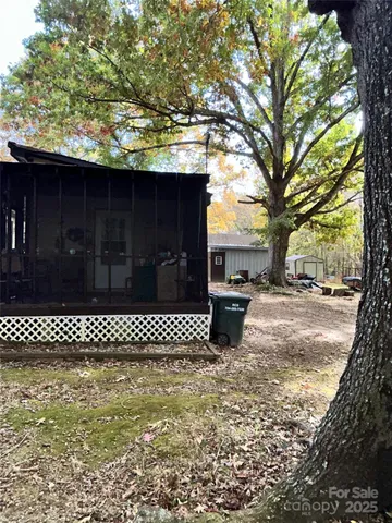 a view of a yard with a bench