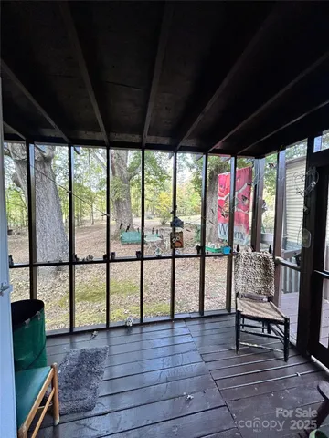 a view of living room with furniture and floor to ceiling window