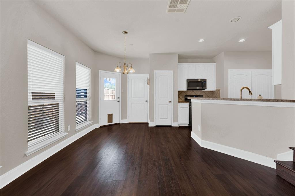 2010 Downing Street Allen, TX 75013 - Photo 15 of 29 a kitchen with stainless steel appliances granite countertop a sink a refrigerator and a stove